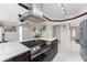 Bright, open kitchen featuring a large island, modern appliances, and dark wood cabinetry at 184 Eppinger Dr, Port Charlotte, FL 33953