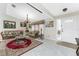 Bright living room with tile floors, vintage furnishings, chandelier, and front door access at 184 Eppinger Dr, Port Charlotte, FL 33953
