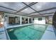 Beautifully screened-in swimming pool offers seamless indoor-outdoor living and tranquil views at 184 Eppinger Dr, Port Charlotte, FL 33953