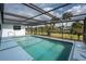 Inviting screened-in swimming pool and manicured landscaping offer relaxation and backyard appeal at 184 Eppinger Dr, Port Charlotte, FL 33953