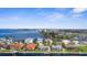 A high-angle view displaying waterfront residences with boat docks, plus a screened pool and waterfront views at 2160 Palm Tree Dr, Punta Gorda, FL 33950