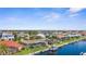 Aerial view features waterfront houses, canals, and manicured lawns, showcasing beautiful coastal neighborhood at 2160 Palm Tree Dr, Punta Gorda, FL 33950