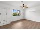 Bright bedroom with light wood floors, shutters, and built in storage at 2160 Palm Tree Dr, Punta Gorda, FL 33950