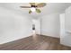 Bright bedroom featuring light wood floors and a ceiling fan at 2160 Palm Tree Dr, Punta Gorda, FL 33950