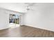 Spacious room featuring wood floor and sliding glass doors to a patio at 2160 Palm Tree Dr, Punta Gorda, FL 33950