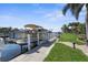 Exterior view of the dock with a boat on the canal waterfront at 2160 Palm Tree Dr, Punta Gorda, FL 33950