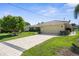 Exterior of the home showing the garage and driveway at 2160 Palm Tree Dr, Punta Gorda, FL 33950