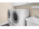 Laundry room with washer, dryer, and sink at 2160 Palm Tree Dr, Punta Gorda, FL 33950