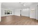 Empty living room with wood floors and an accent wall at 2160 Palm Tree Dr, Punta Gorda, FL 33950