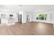 Bright open floorplan with a white kitchen and spacious living area filled with natural light at 2160 Palm Tree Dr, Punta Gorda, FL 33950