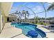 Screened-in pool and hot tub with a waterfront view at 2160 Palm Tree Dr, Punta Gorda, FL 33950