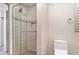 Modern tiled shower with glass door and wall niche, adjacent to a toilet at 2160 Palm Tree Dr, Punta Gorda, FL 33950