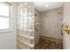 Modern tile shower featuring glass block wall and pebble stone bench at 2160 Palm Tree Dr, Punta Gorda, FL 33950