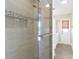 Elegant tiled shower with glass door and built in shelf at 2160 Palm Tree Dr, Punta Gorda, FL 33950