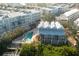 Overhead view of homes boasting a sparkling community pool, lush landscaping, and Gulf access at 2255 N Beach Rd # 13, Englewood, FL 34223