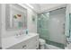 The bathroom features a glass enclosed shower and white vanity at 2255 N Beach Rd # 13, Englewood, FL 34223