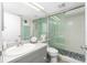 This bathroom features a shower with a glass door at 2255 N Beach Rd # 13, Englewood, FL 34223