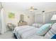 This bedroom features two beds, ceiling fan, and closet space at 2255 N Beach Rd # 13, Englewood, FL 34223