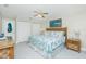 This main bedroom features a ceiling fan and an ensuite bath at 2255 N Beach Rd # 13, Englewood, FL 34223