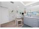 Bright kitchen featuring sleek countertops, modern appliances, and a view to the living area at 2255 N Beach Rd # 13, Englewood, FL 34223