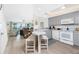 Open-concept kitchen featuring modern appliances, breakfast bar, and seamless flow to the living area at 2255 N Beach Rd # 13, Englewood, FL 34223