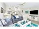Cozy living room with stylish decor, comfortable seating, and a coastal vibe at 2255 N Beach Rd # 13, Englewood, FL 34223