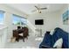 Bright loft featuring a home office, futon, and ample natural light at 2255 N Beach Rd # 13, Englewood, FL 34223