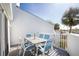Outdoor patio featuring table and chairs and a sunny view of a palm tree at 2255 N Beach Rd # 13, Englewood, FL 34223