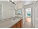 Bright bathroom features updated vanity, lighting, and tile flooring at 2495 De Garmo St, North Port, FL 34291