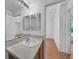 Light-filled bathroom with tile flooring and vanity at 2495 De Garmo St, North Port, FL 34291