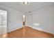 Bright bedroom with laminate flooring, showing access to the bathroom and closet at 2495 De Garmo St, North Port, FL 34291