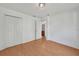 Bedroom featuring a large closet, laminate flooring and private bathroom at 2495 De Garmo St, North Port, FL 34291