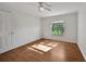 Bright bedroom with wood floor, a ceiling fan and ample natural light at 2495 De Garmo St, North Port, FL 34291