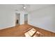 Bright bedroom with ceiling fan, wood flooring, and bathroom access at 2495 De Garmo St, North Port, FL 34291