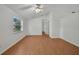 Bright bedroom with neutral walls, stylish floors, vaulted ceiling, and a large window at 2495 De Garmo St, North Port, FL 34291