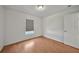 Simple bedroom with laminate flooring and a large window for natural light at 2495 De Garmo St, North Port, FL 34291