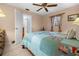 Inviting bedroom featuring a decorative quilt, ceiling fan, and warm, cozy ambiance at 3 Bunker Pl, Rotonda West, FL 33947