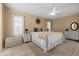 Bright main bedroom featuring a serene atmosphere, ceiling fan, and stylish decor at 3 Bunker Pl, Rotonda West, FL 33947