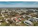 An aerial view of a coastal community with single Gathering homes and lush trees at 3210 Holly Ave, Englewood, FL 34224