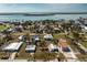 Aerial view showcasing the property's location within a residential area and proximity to the waterfront at 3210 Holly Ave, Englewood, FL 34224