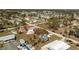 An aerial view of a coastal community with many trees and single Gathering homes at 3210 Holly Ave, Englewood, FL 34224
