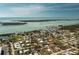 Breathtaking aerial view of the property near the waterfront, showcasing the surrounding landscape and community at 3210 Holly Ave, Englewood, FL 34224