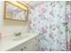 Bathroom featuring a vanity sink and a shower with a floral-patterned curtain at 3210 Holly Ave, Englewood, FL 34224