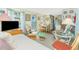 Living area seamlessly connects to the dining and kitchen space with comfortable seating and natural light at 3210 Holly Ave, Englewood, FL 34224