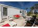 Outdoor patio with lounge chairs, providing an area for relaxing or entertaining at 3210 Holly Ave, Englewood, FL 34224