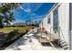 Patio with outdoor seating and manicured landscaping, perfect for relaxing at 3210 Holly Ave, Englewood, FL 34224