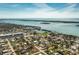 Panoramic aerial view of waterfront community, offering serene waters, lush greenery, and convenient access to amenities at 3220 Holly Ave, Englewood, FL 34224