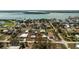 Scenic aerial shot showcases a waterfront home with quick access to boating, fishing, and coastal amenities at 3220 Holly Ave, Englewood, FL 34224