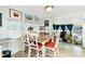 Bright dining room with natural light, wood table, and cozy seating for Gathering meals at 3220 Holly Ave, Englewood, FL 34224