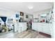 Clean kitchen with white cabinets, modern wood flooring, and essential appliances at 3220 Holly Ave, Englewood, FL 34224
